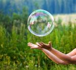 7457020-hand-catching-a-soap-bubble